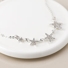 Load image into Gallery viewer, Silver Plated Graduated Crystal Star Necklace
